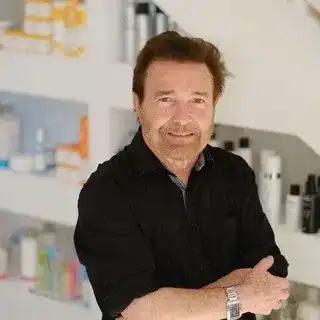 Portrait of Dino Laudati, a professional stylist at Athena Medspa and Salon, showcasing their expertise and style.