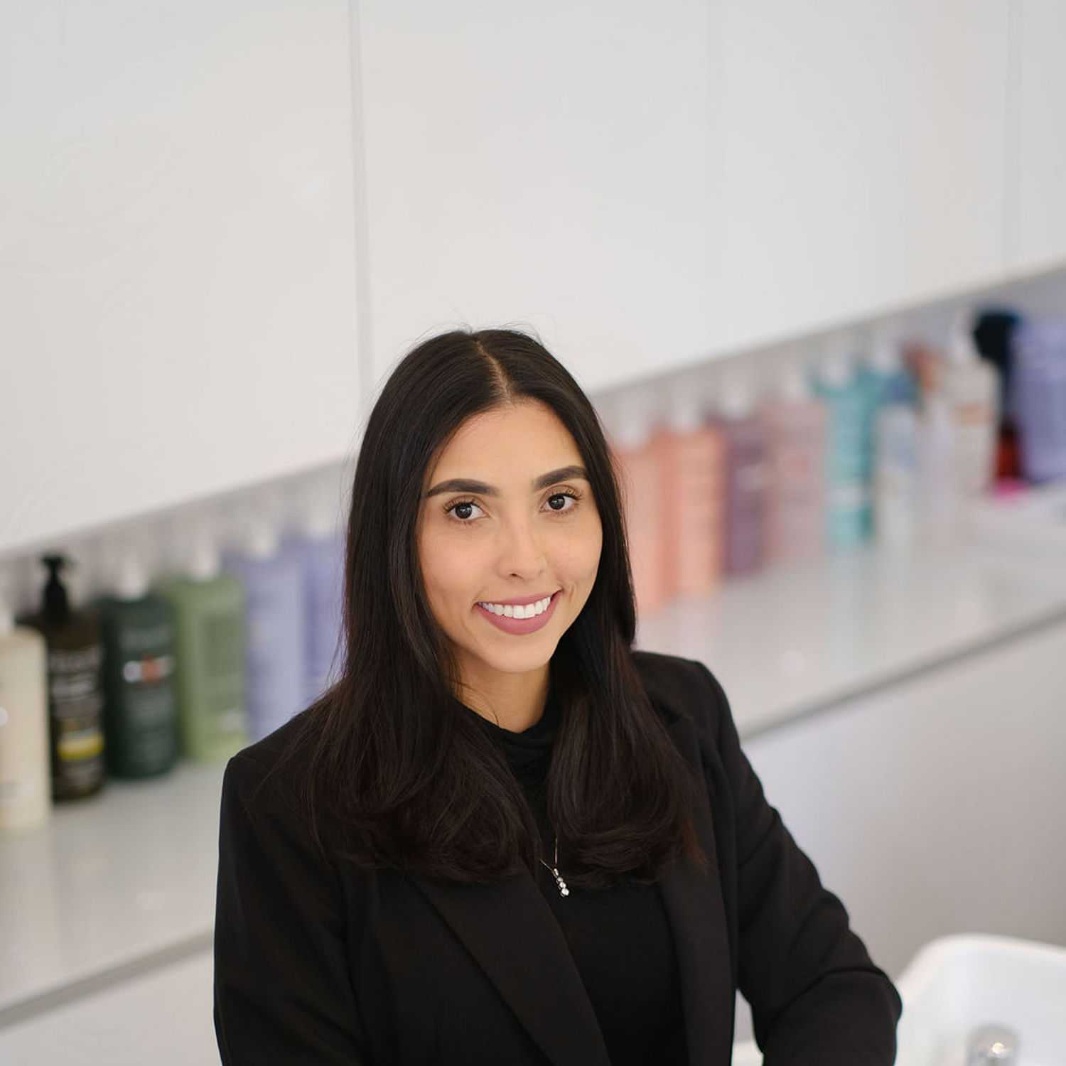 Portrait of Daniela Infante, a professional stylist at Athena Medspa and Salon, showcasing their expertise and style.
