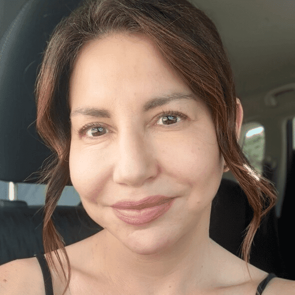 Portrait of Polina Yesilevich, a professional stylist at Athena Medspa and Salon, showcasing their expertise and style.