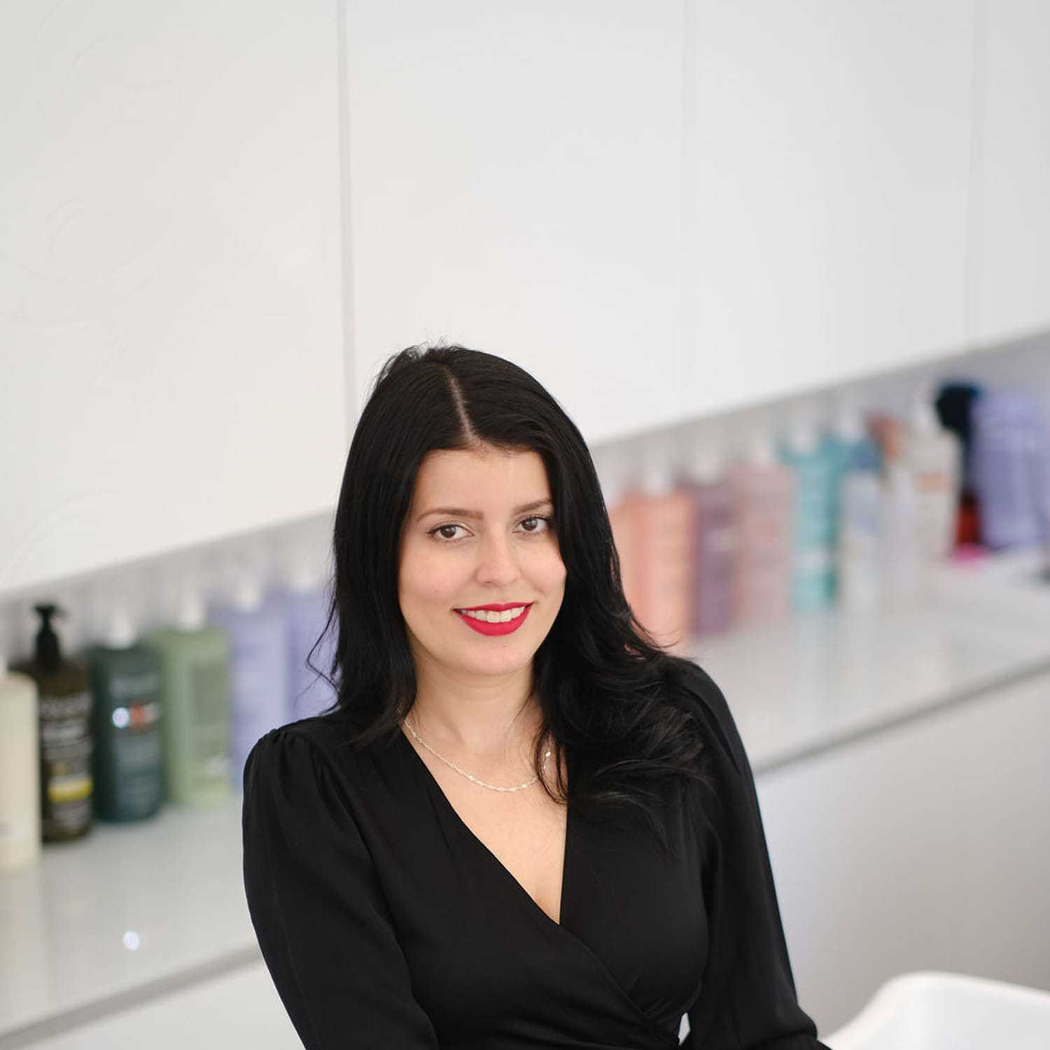 Portrait of Laura Arredondo, a professional stylist at Athena Medspa and Salon, showcasing their expertise and style.