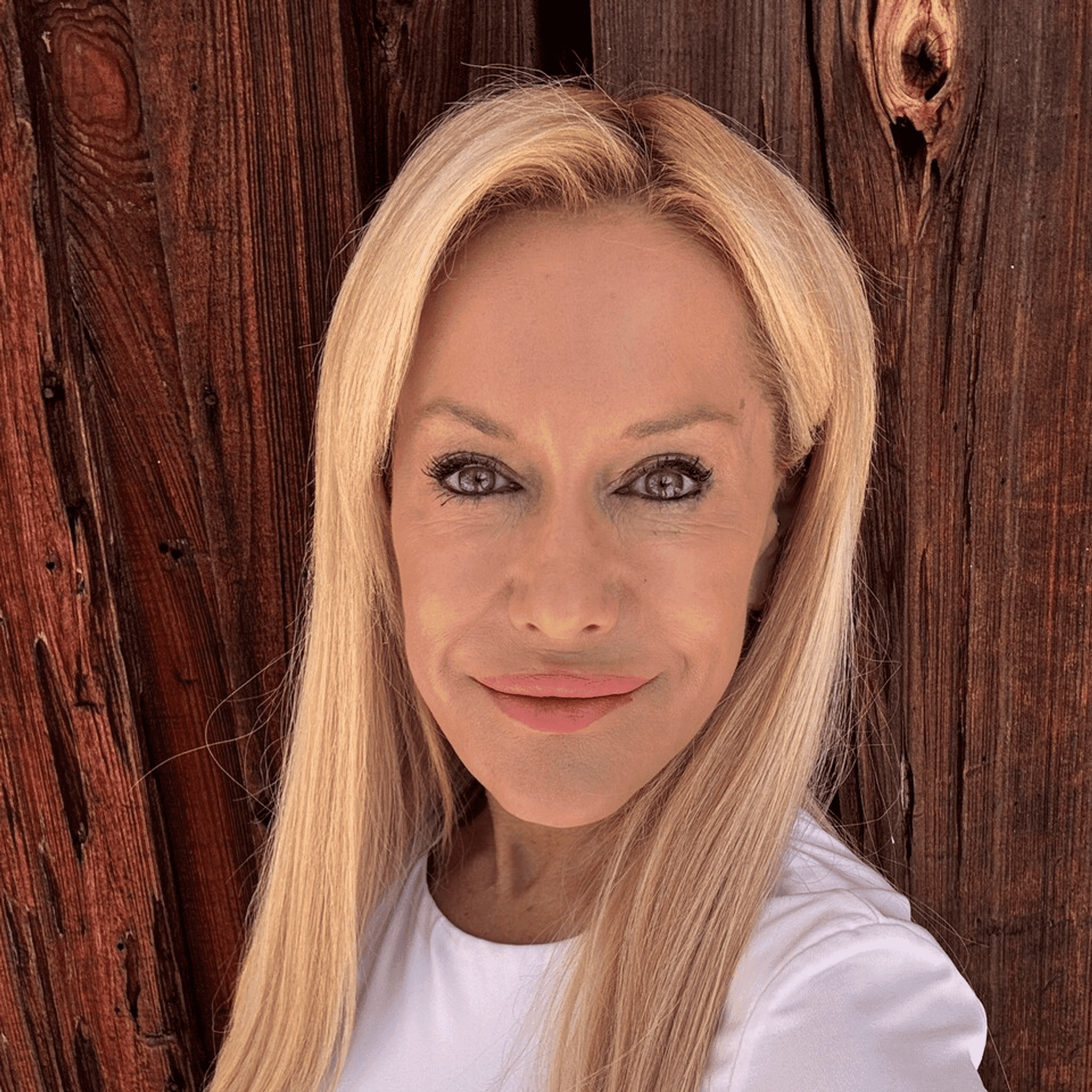 Portrait of Linda Oberman, a professional stylist at Athena Medspa and Salon, showcasing their expertise and style.