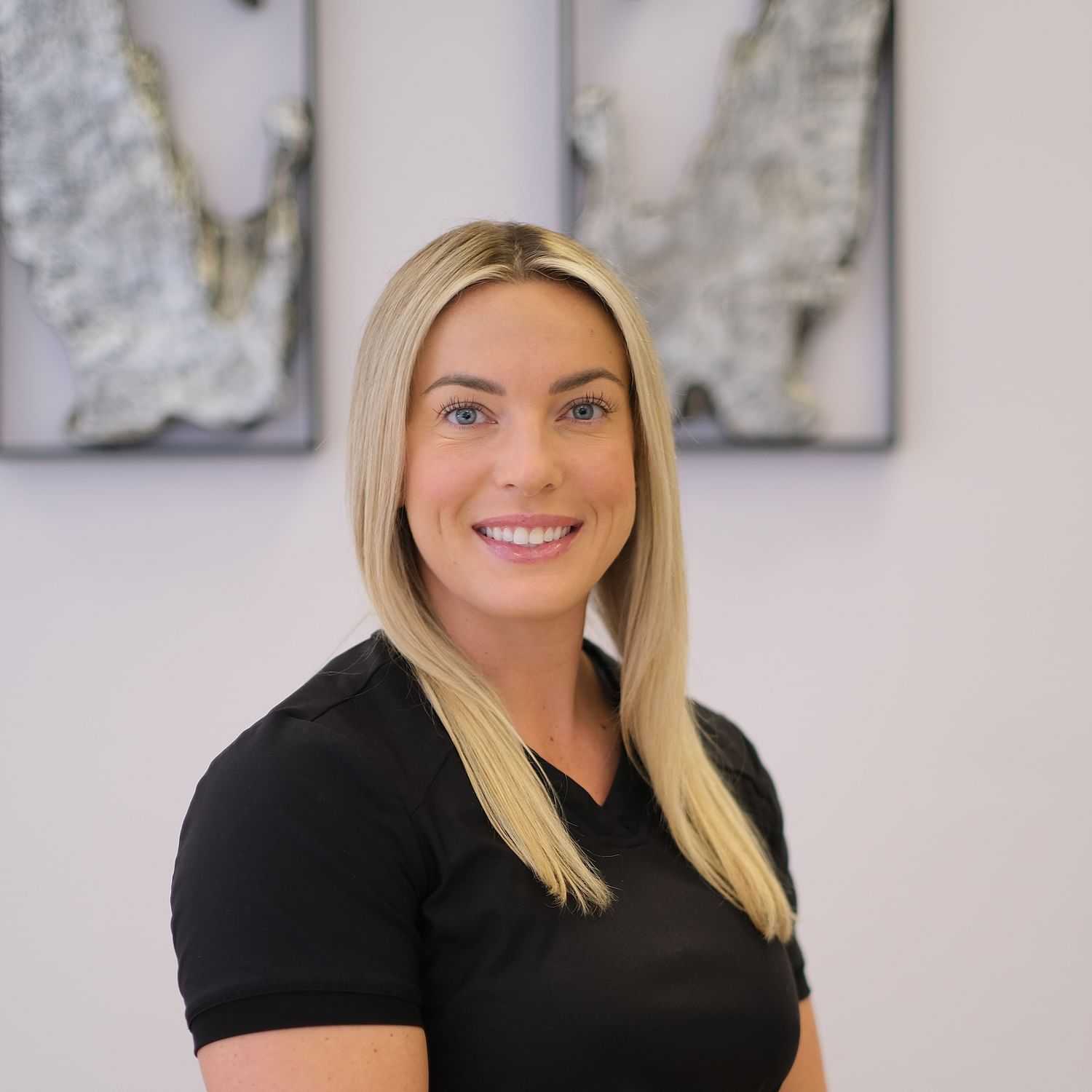 Portrait of Olivia Taylor, a professional stylist at Athena Medspa and Salon, showcasing their expertise and style.